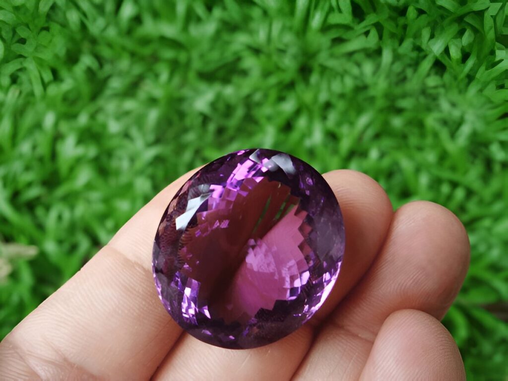 Natural amethyst gemstone with grass background-2