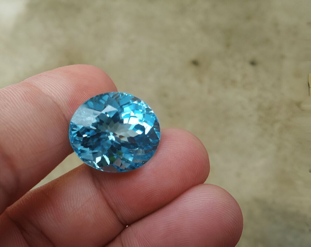 Precious Blue Topaz Gemstone in Hand