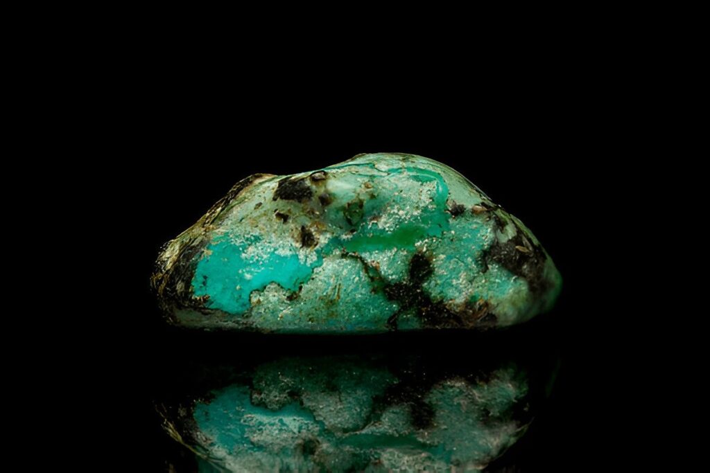 Closeup natural green turquoise gemstone on dark background